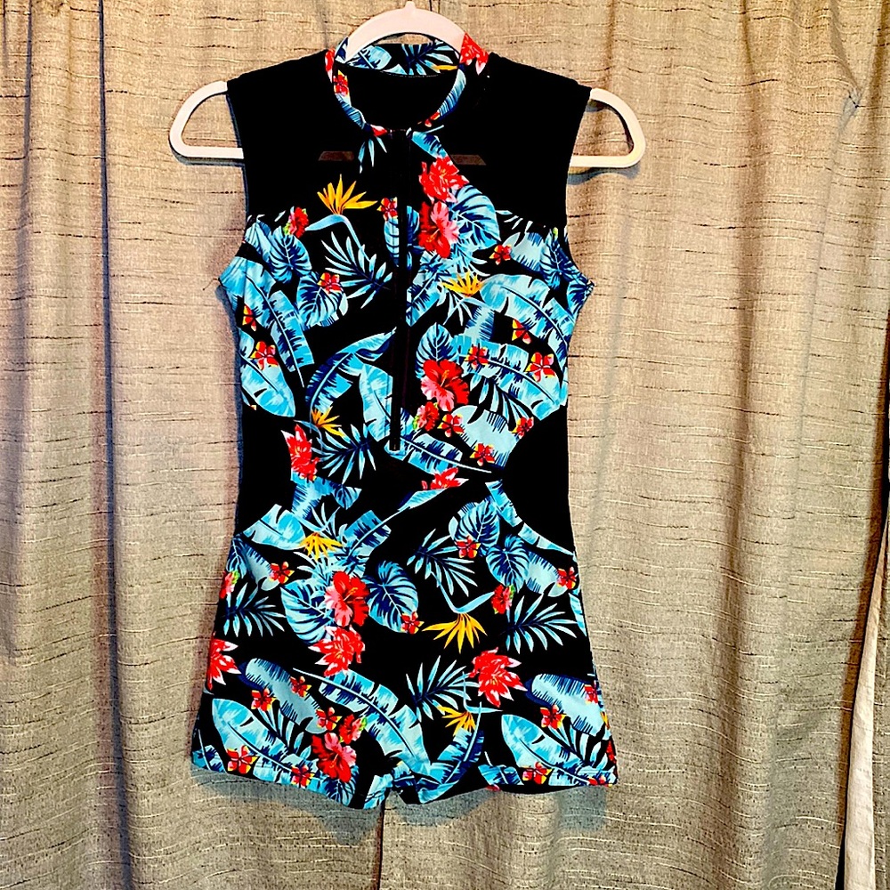 Tropical print, zip front, one piece suit.